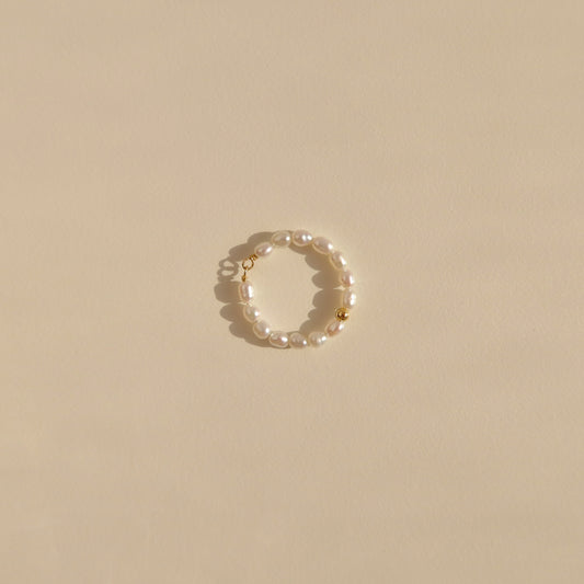Pearl ring with a gold bead