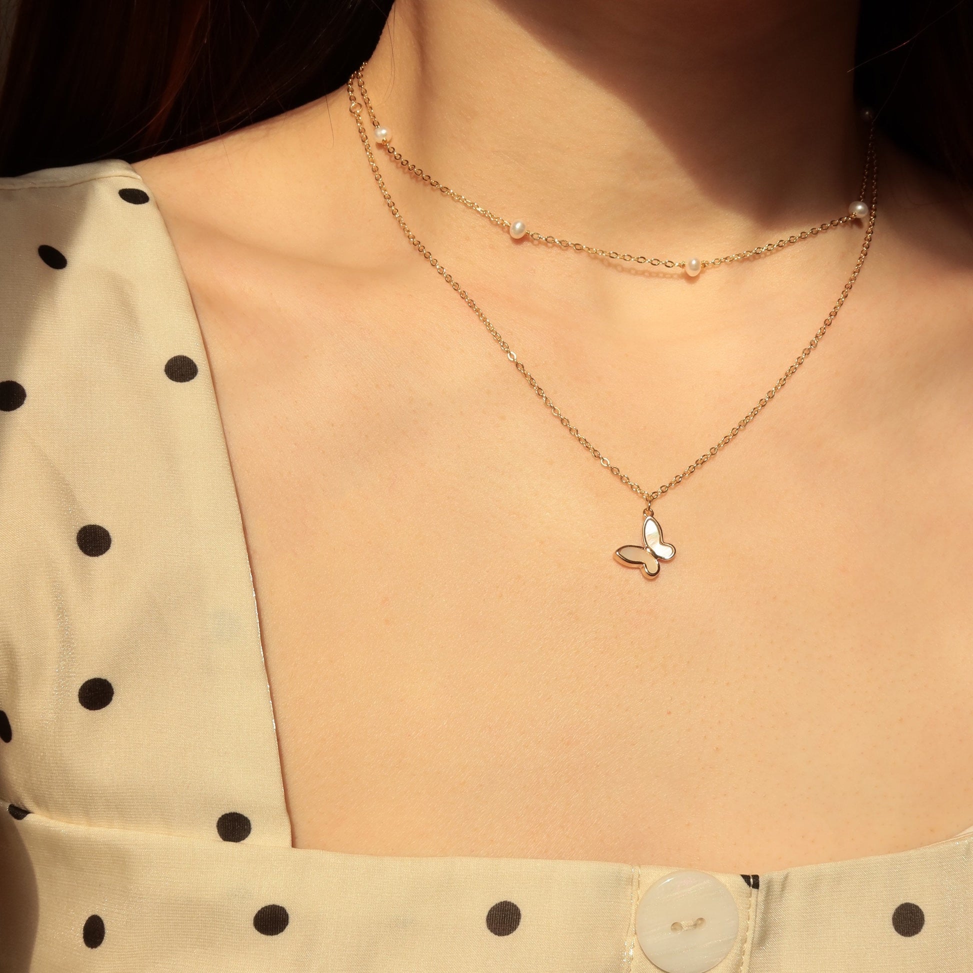 Pearl bead necklace and butterfly necklace