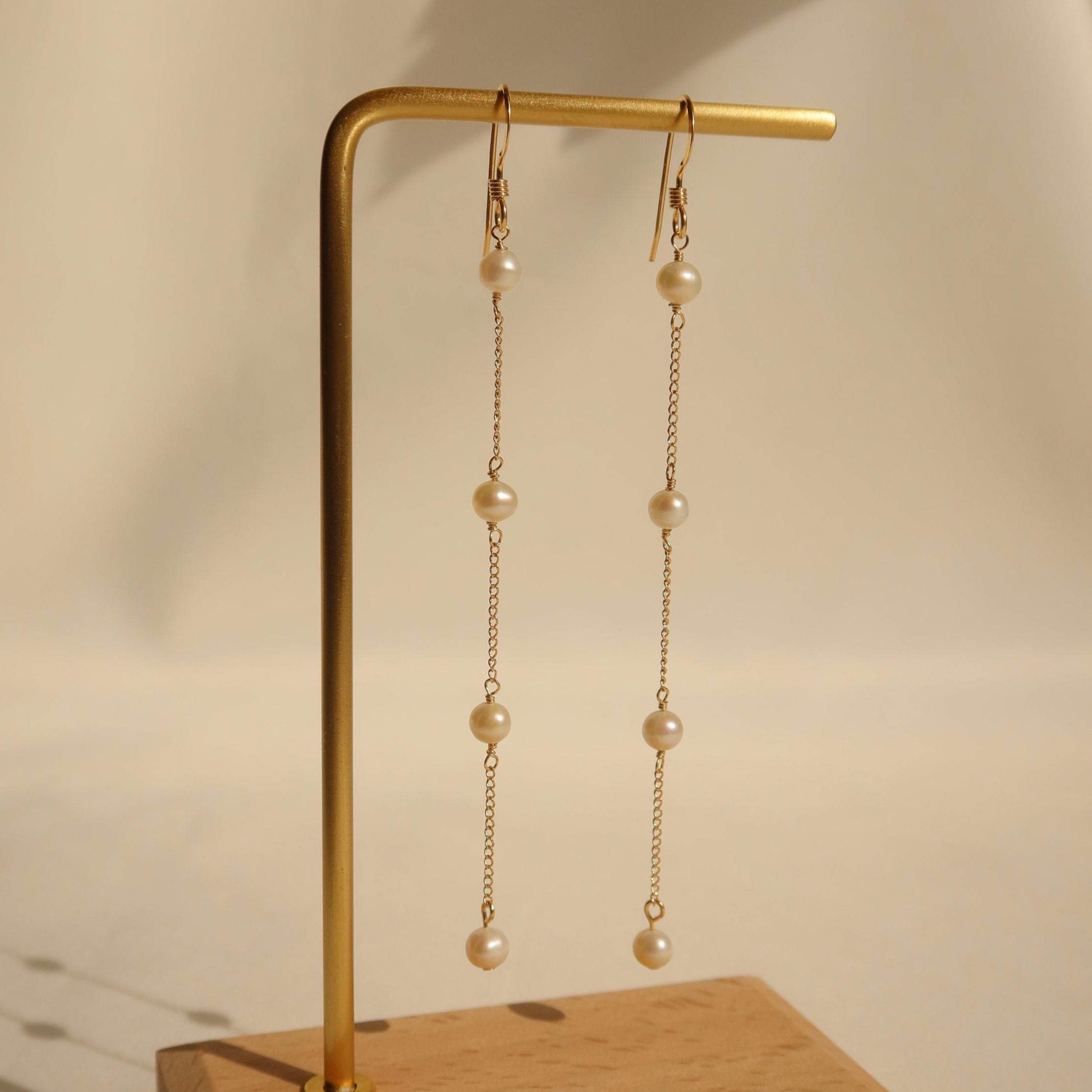 Pearl long drop earring