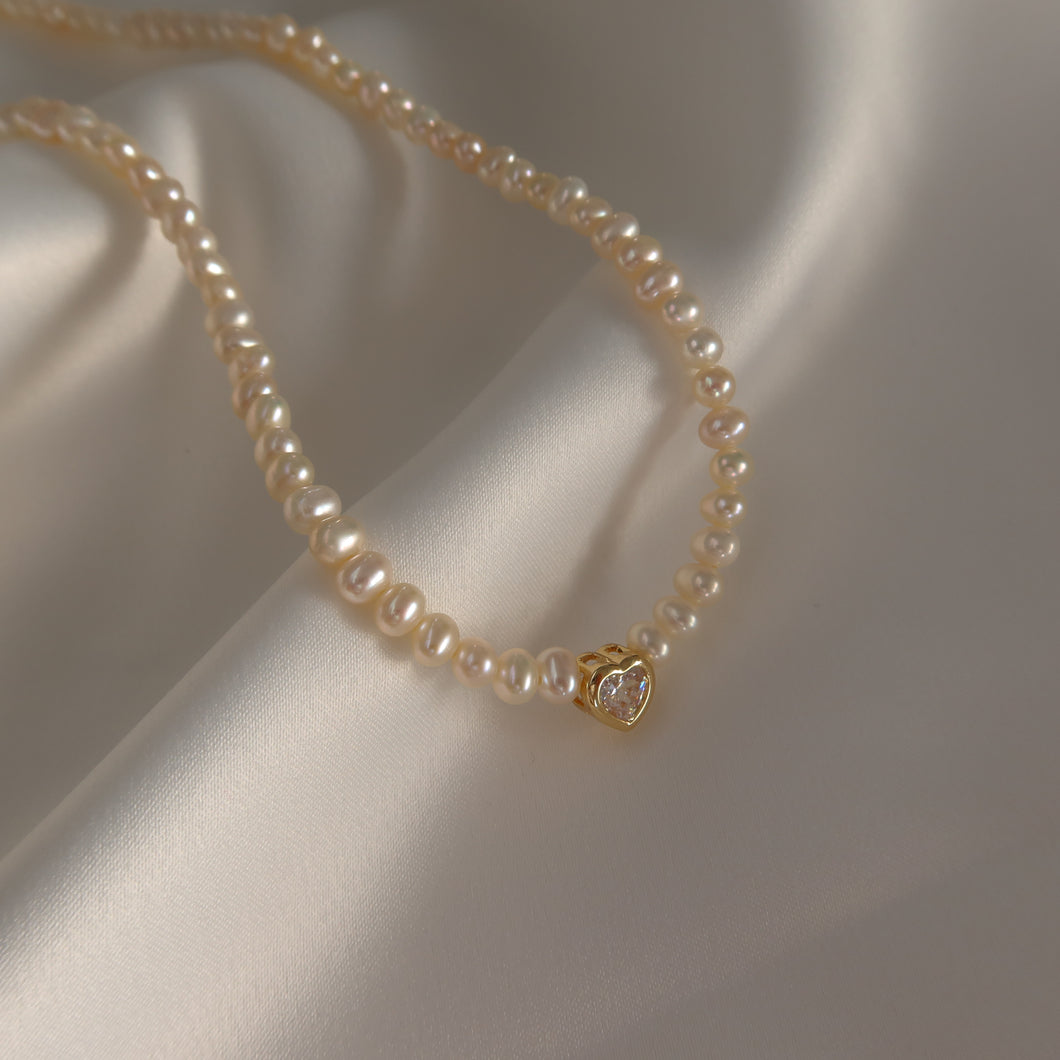 Pearl necklace with heart charm